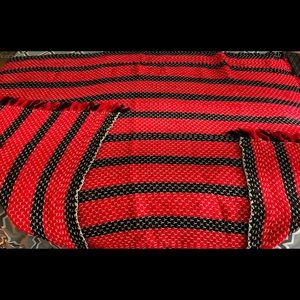 Red and black knitted throw blanket.